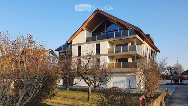3 story house, beige exterior, wooden gable roof, balconies, garden, garage