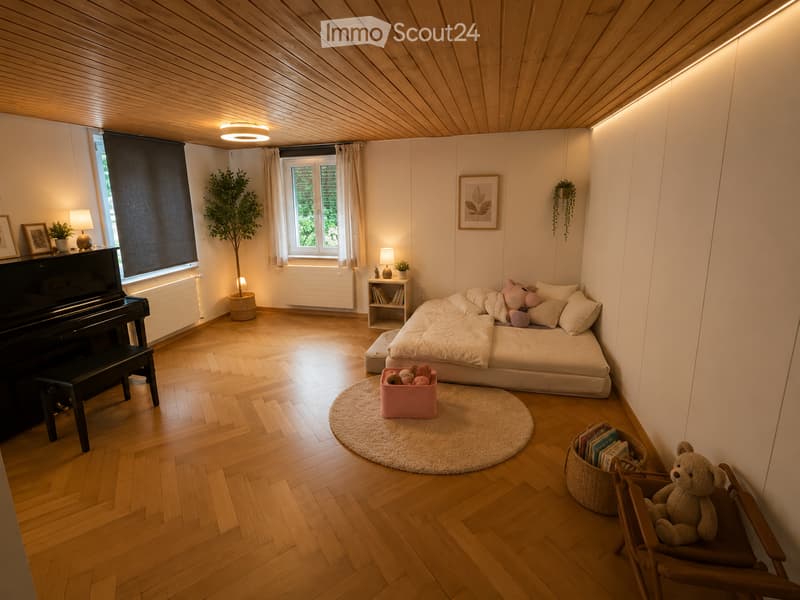 Cozy bedroom with wooden flooring, slanted wooden ceiling, large window with curtains, bed with pillows and blankets, piano, small table with lamp, and decorative items.