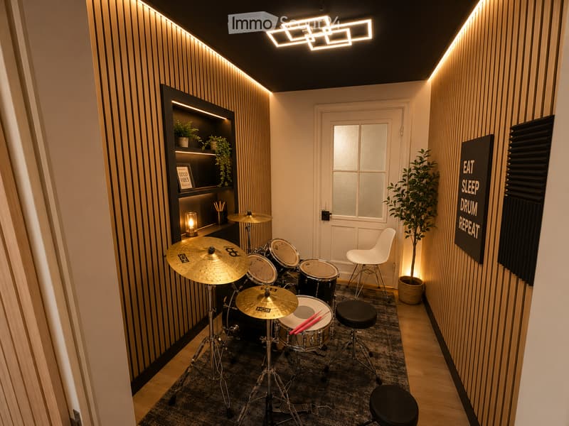 Modern, compact room with a drum set, cymbals, and drumsticks on stands, a white chair, a black stool, a potted plant, a shelf with a lamp and picture frame, and a sign that reads "EAT SLEEP DRUM REPEAT".