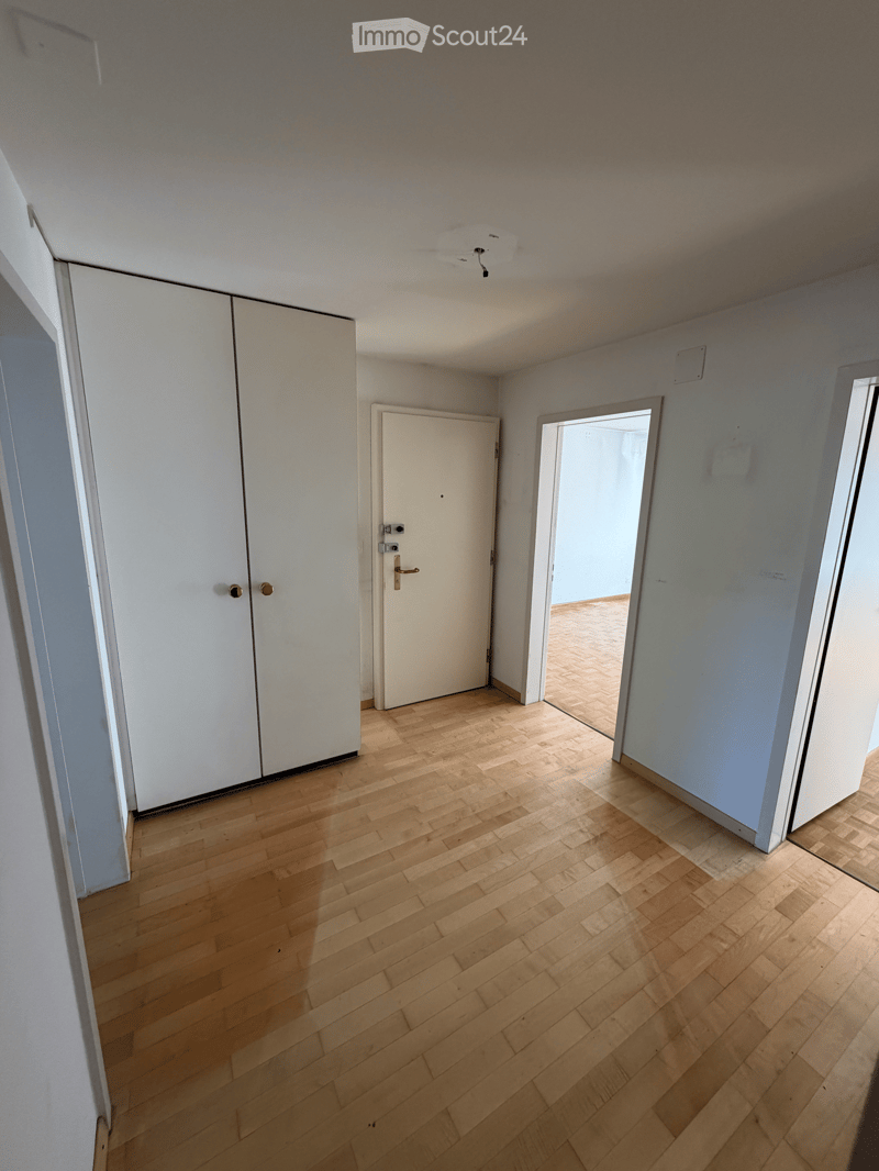 Empty room with wooden flooring, white walls, and a white closet. No furniture or equipment is present.