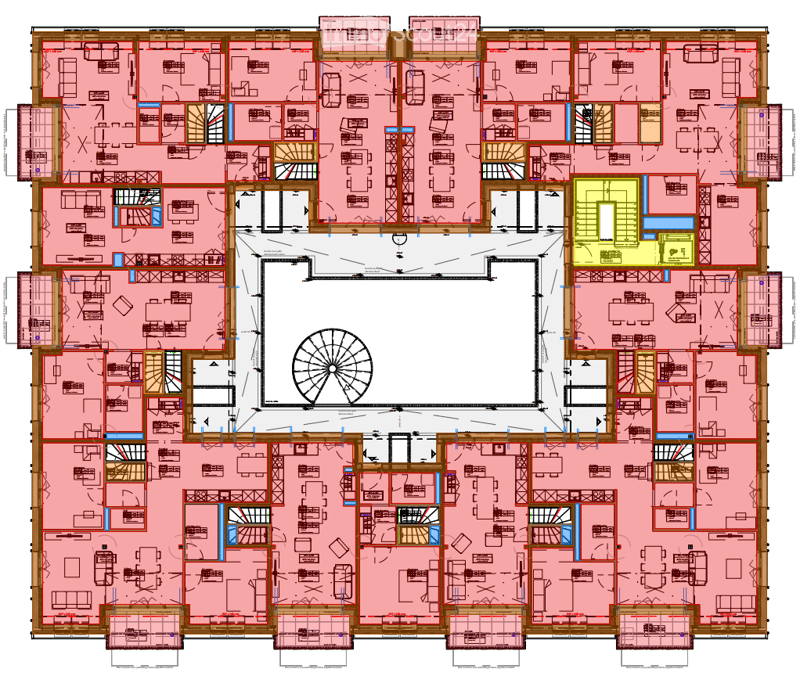 Floor plan of a large building with multiple rooms, including bedrooms, bathrooms, and common areas. The layout includes a central circular space and several smaller rooms arranged around it.