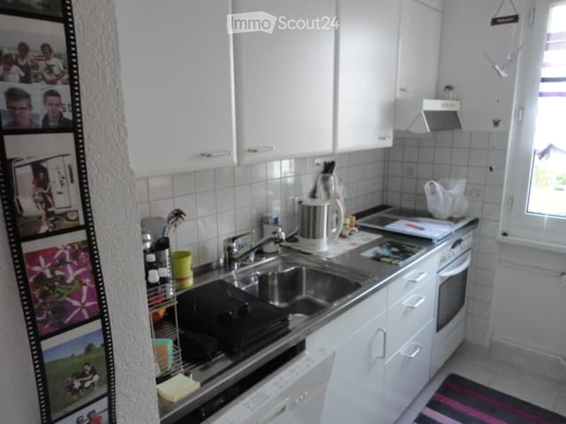 {"type": "Kitchen", "objects": ["sink", "faucet", "oven", "dishwasher", "cup", "bottle", "fridge", "fridge magnet", "fridge photo", "fridge photo", "fridge photo", "fridge photo", "fridge photo", "fridge photo", "fridge photo", "fridge photo", "fridge pho
