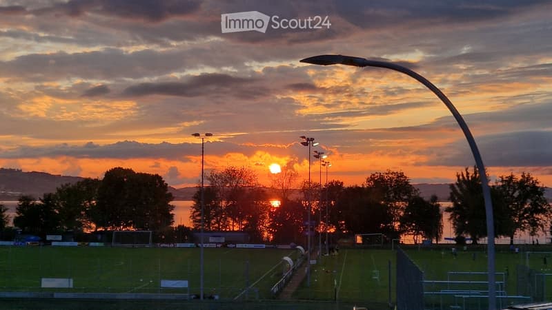 Outdoors with a view of a setting sun