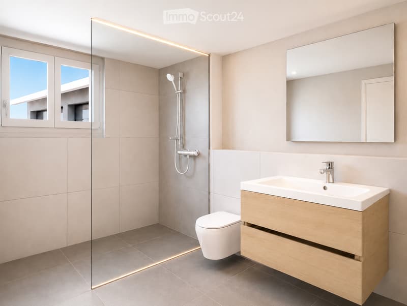 Modern bathroom with a white toilet, wooden vanity with a sink, large mirror, and a glass-enclosed shower area with a modern showerhead.