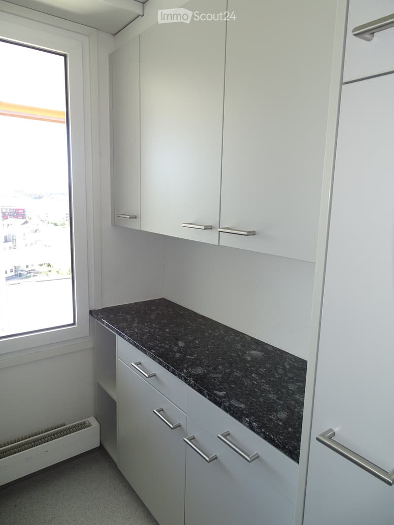 white cabinets, black granite countertop, floor heating, window