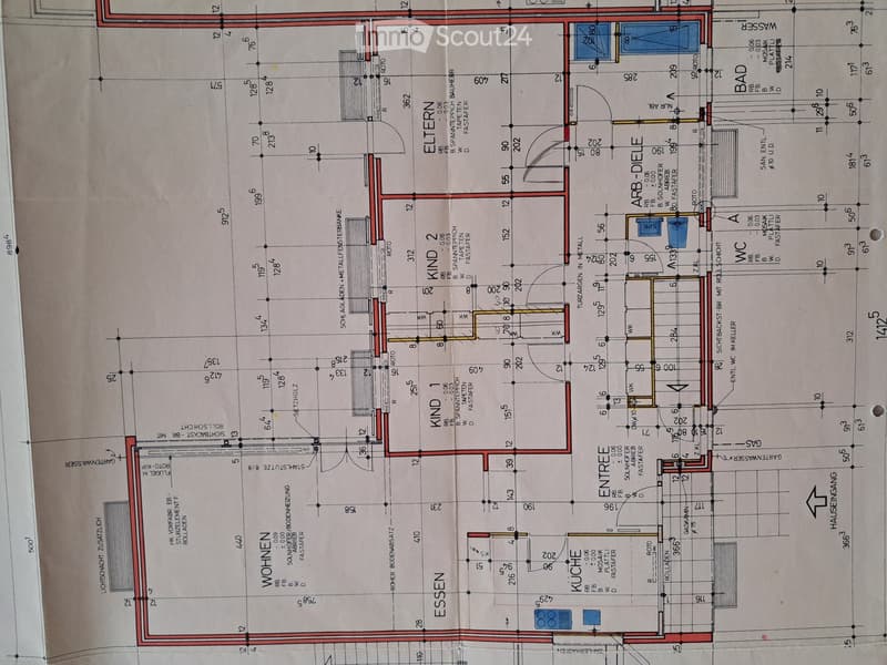 Floor plan of a residential building showing multiple rooms including kitchen, dining, living, bedrooms, and bathrooms, with labeled dimensions and room names.