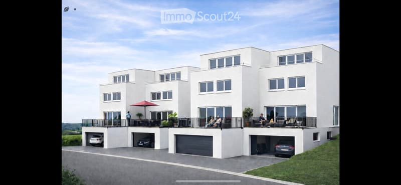 Modern3-story white house with large windows, balconies, and multiple garages.