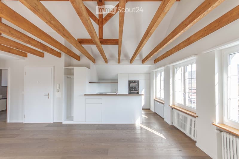 {"visible_features": [],    "type": "Room",    "description": "Open kitchen with kitchen appliances, large wooden beams, white walls, large windows, hardwood floors",    "localized_descriptions":        {        "EN": "Open kitchen with kitchen appli