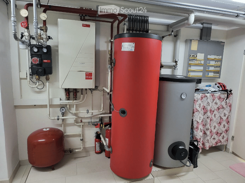 Utility room with water heaters, pipes, and fire extinguishers