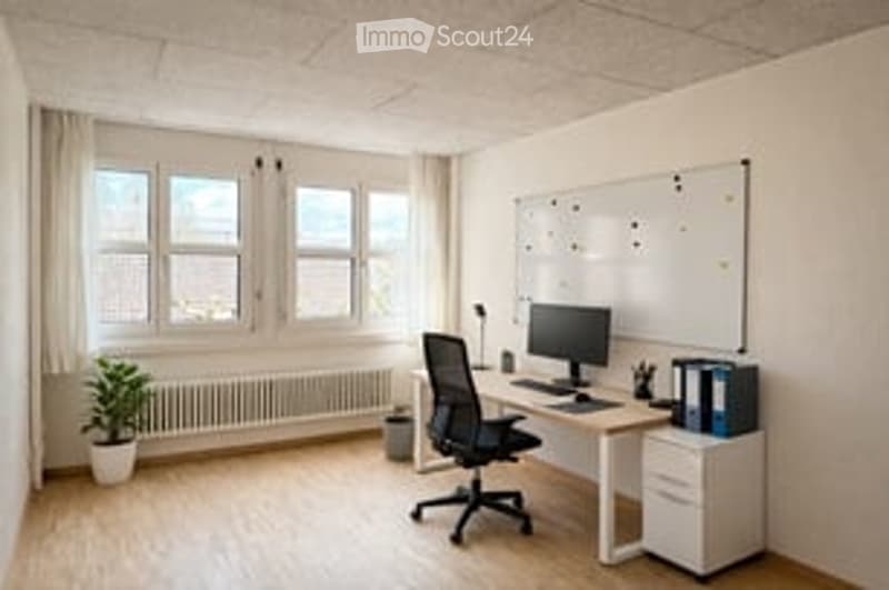 Bright, modern office space with large windows, a desk, chair, computer, and a small plant. The room features white walls, wooden flooring, and a whiteboard on one wall.