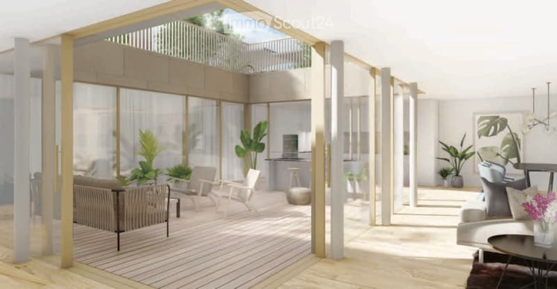 Modern, open-concept living space with large glass walls, a balcony, and contemporary furniture including a sofa, coffee table, chairs, and a small kitchen area.