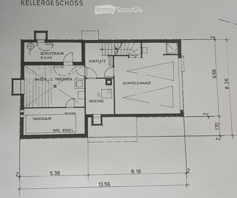 Floor plan showing a basement level with a double garage, heating room, washing and drying area, protection room, and fuel tank room.