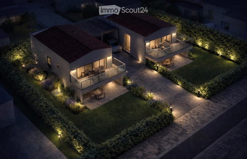 Modern two-story house with tiled roofs, illuminated balconies, garage, and outdoor seating areas.