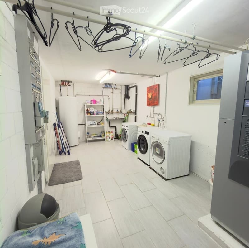 {"type": "Bathroom", "objects": ["washing machine", "dryer", "shelf", "hanger", "trash bin", "bottle", "faucet", "pipe", "bottle", "bottle", "bottle", "bottle", "bottle", "bottle", "bottle", "bottle", "bottle", "bottle", "bottle", "bottle", "bottle", "bot