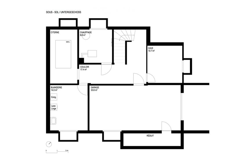 Floor plan of a basement level showing rooms labeled: Citadelle, Chaufferie, Couloir, Garage, Buanderie, Cave, and Réduit.