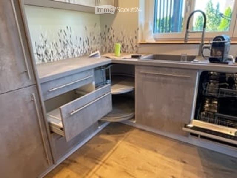 kitchen with island, dishwasher, washing machine, cabinets, countertop, sink, faucet, open drawers