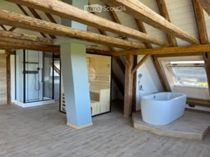 wooden beams, wooden floor, white bathtub, shower, sauna, wooden wall