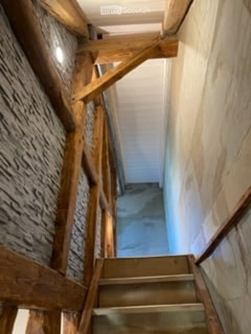 wooden ceiling, brick wall, wooden stairs