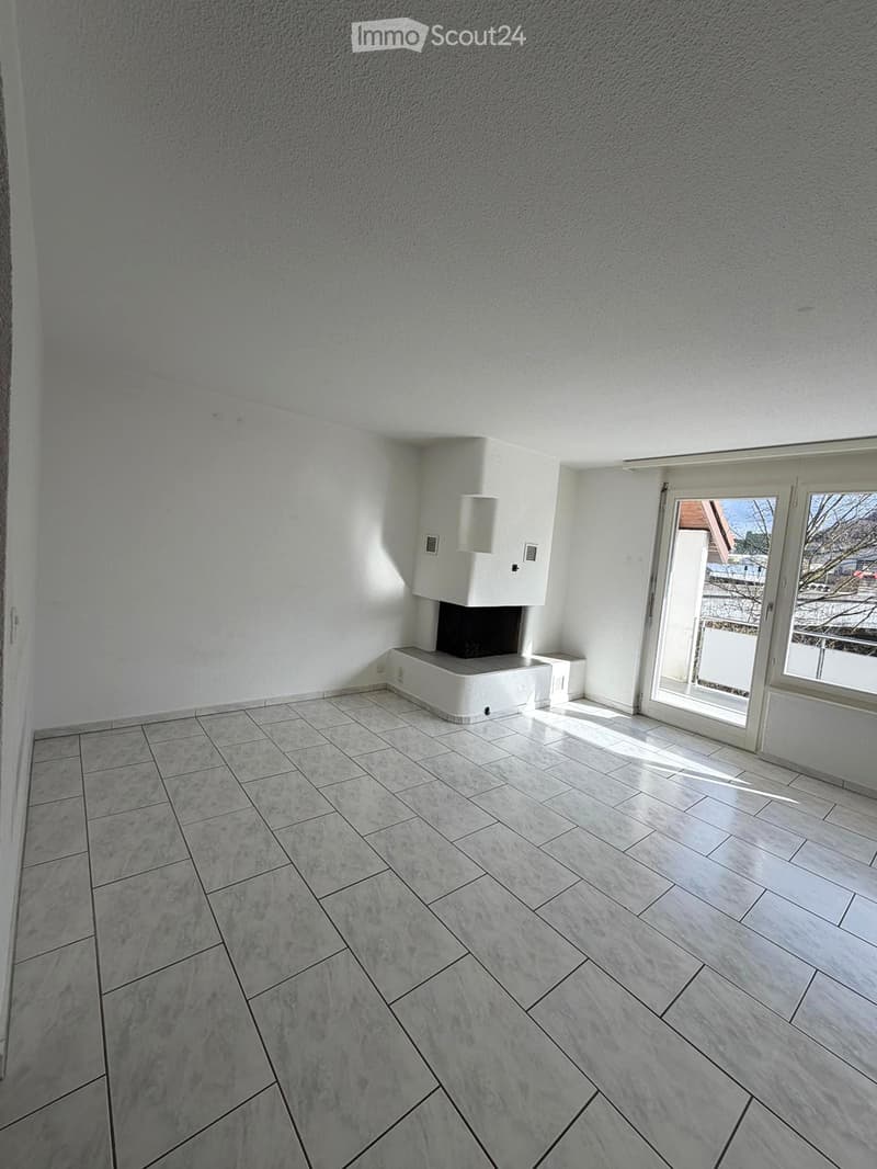 empty room, white walls, white tiles, fireplace, balcony