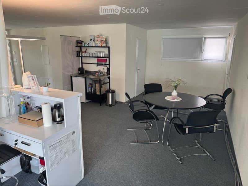 {"type": "Furnished Room", "objects": ["reception desk", "chair", "table", "cupboard", "fridge", "sink", "cupboard", "chair", "cupboard", "cupboard", "cupboard", "cupboard", "cupboard", "cupboard", "cupboard", "cupboard", "cupboard", "cupboard", "cupboard
