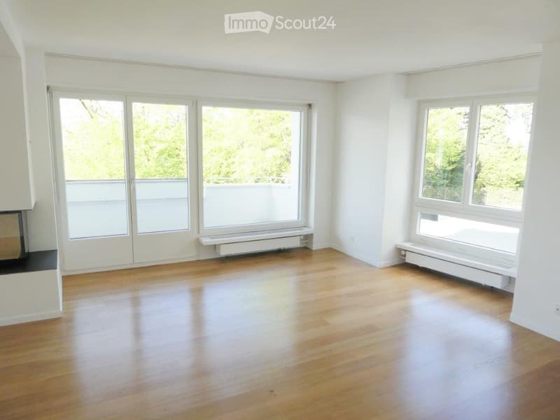 Completely empty room with bare white walls and wooden floor. No furniture or equipment.
