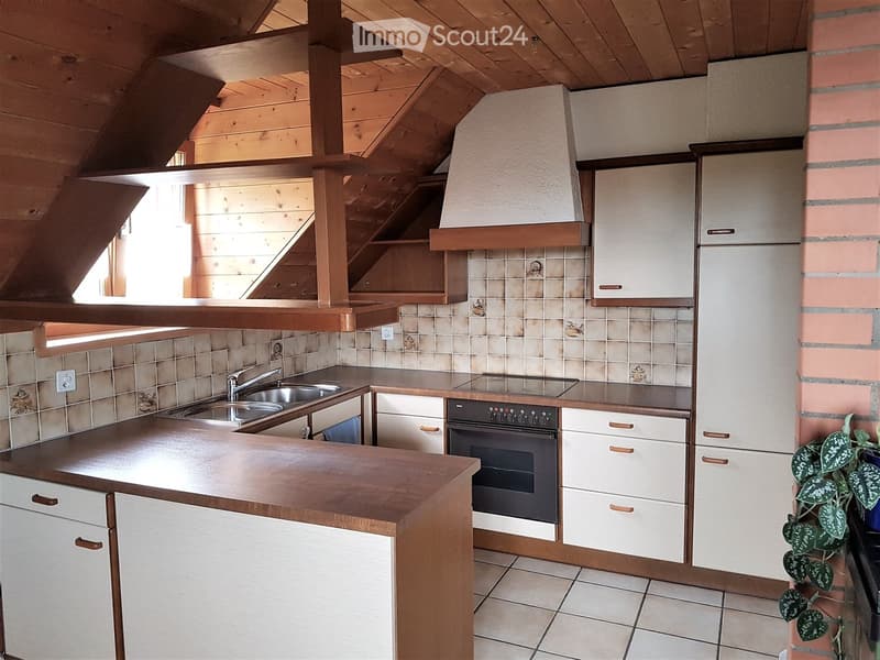 kitchen with wooden ceiling, white cabinets, tiled backsplash, double sink, oven, tiled floor
