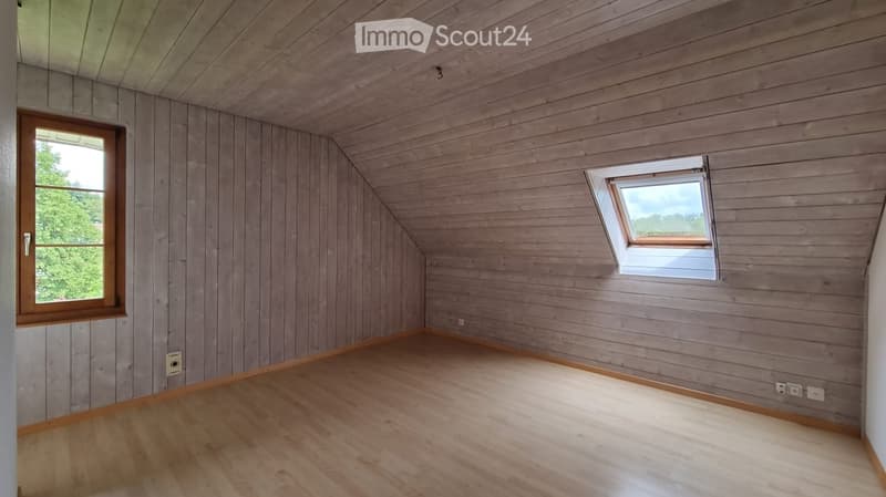 empty room, wooden walls, wooden floor, two windows, power outlets