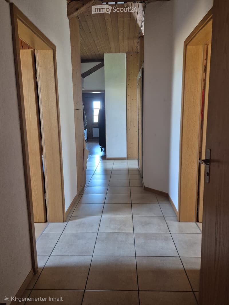 A clean, well-lit hallway with tiled flooring and wooden doors on both sides, leading to another room with visible furniture.