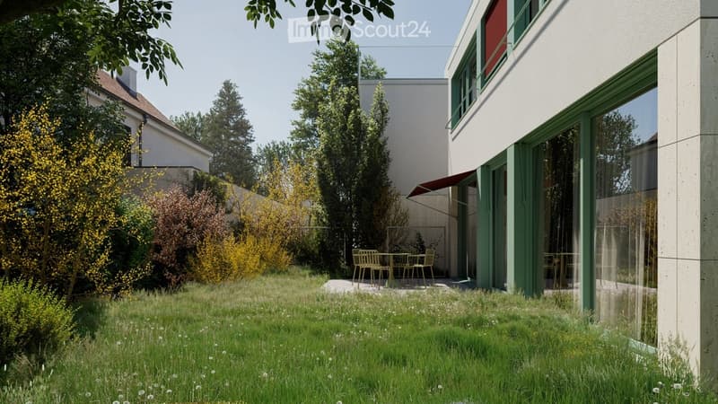 A modern garden area with a lawn, small trees, and a patio with outdoor furniture near a contemporary building.