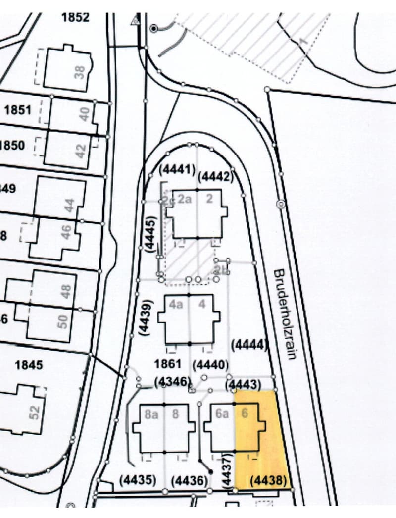 Floor plan showing multiple plots and buildings with labeled sections and numbers, including a highlighted area in yellow.