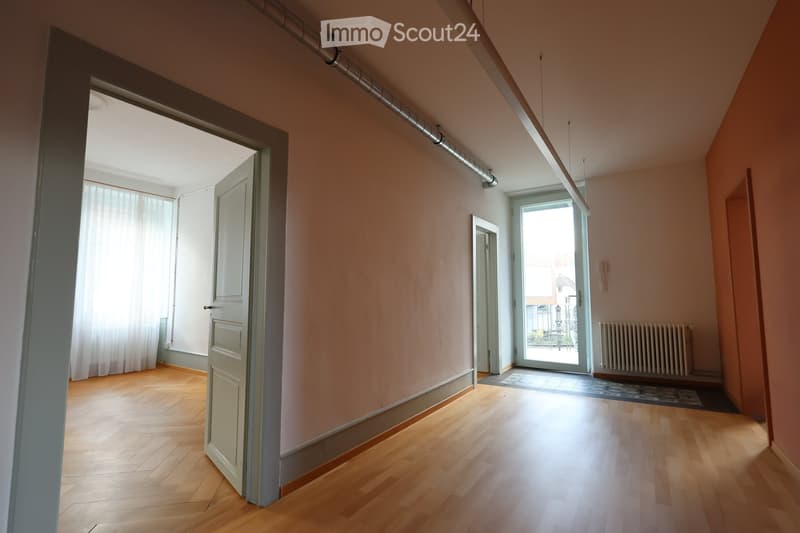 room, white walls, wooden floor, doors, window, white curtains, radiator