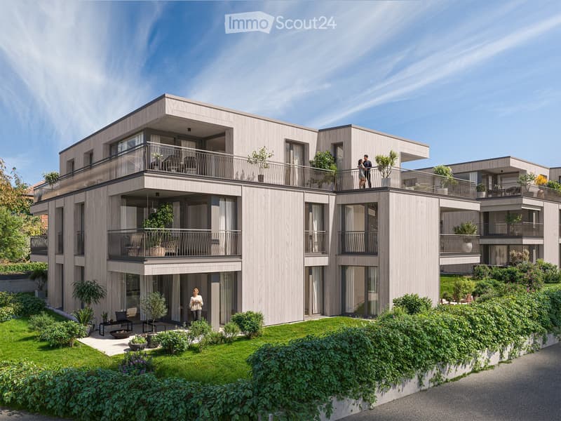 Modern, multi-story residential building with balconies, large windows, and surrounding greenery.
