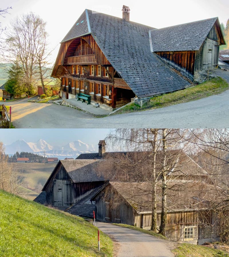 Traditional wooden house, steep roof, wooden exterior, multiple windows, green bench, surrounded by trees and grass, mountain view