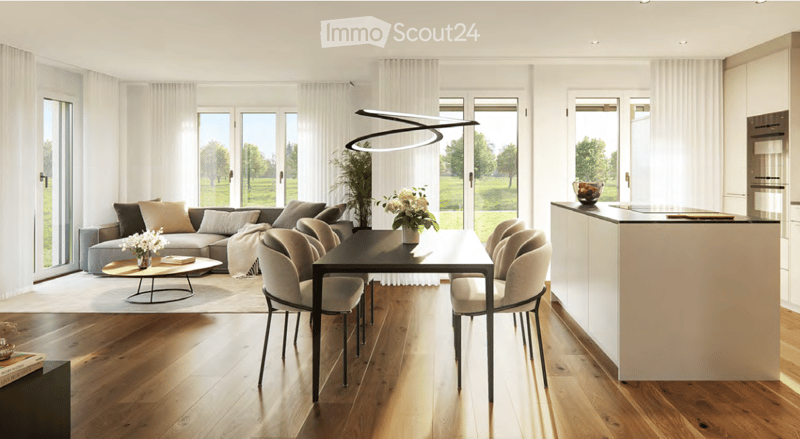Open-plan living and dining area with modern furniture, large windows, and a kitchen island.