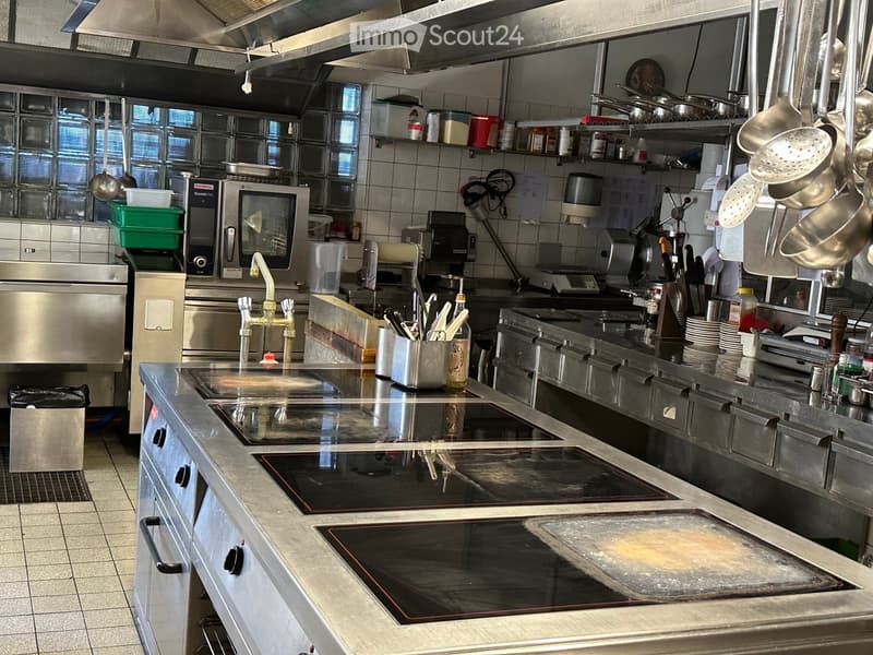 {"type": "Kitchen", "objects": ["induction cooktop", "faucet", "microwave", "oven", "fridge", "sink", "pot", "pan", "cupboard", "bottle", "frying pan", "dishwasher", "oven", "faucet", "cupboard", "fridge", "oven", "microwave", "sink", "faucet", "oven", "o