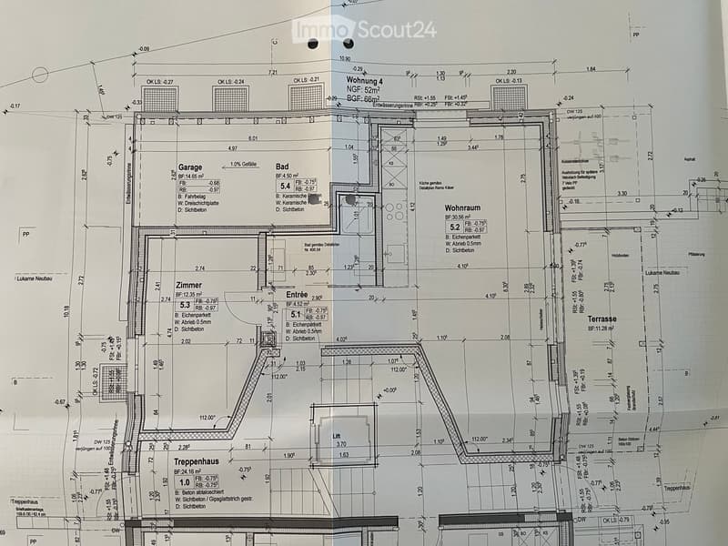 Floor plan of a multi-room apartment including a living room, kitchen, bedroom, bathroom, garage, and terrace.