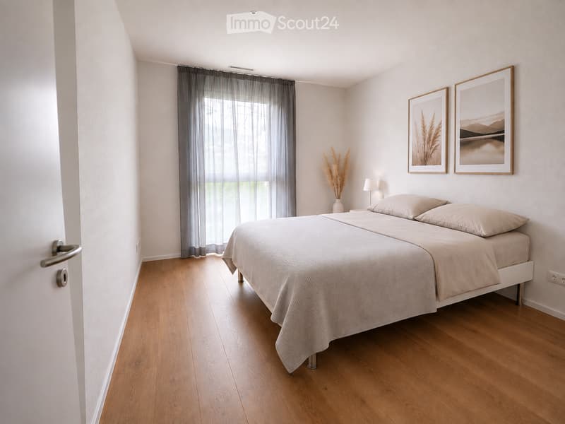 Modern bedroom with a double bed, light-colored bedding, wooden flooring, large window with grey curtains, nightstand with lamp, decorative vase, and two picture frames on the wall.