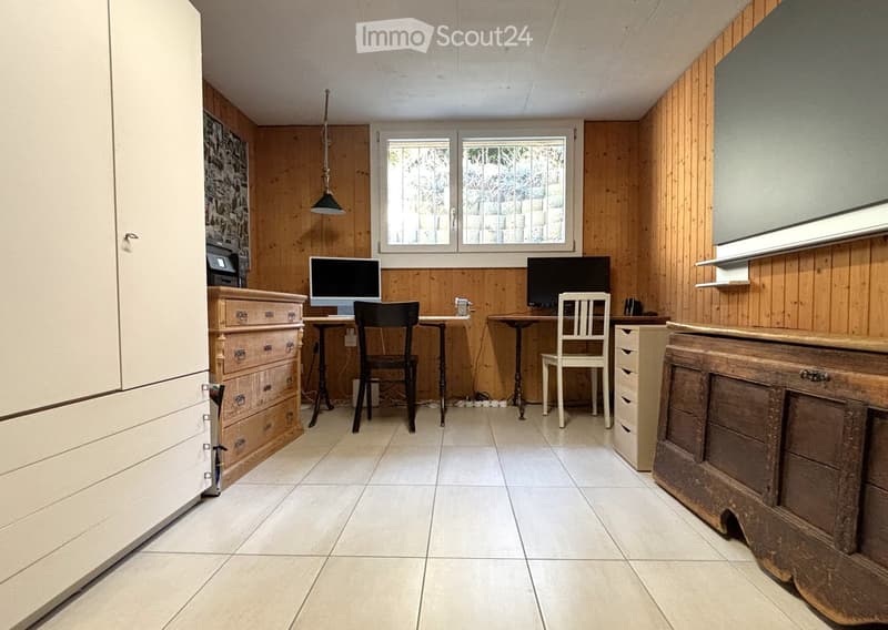 wooden wall, white tiled floor, two wooden desk with computer, chairs, and wooden cabinet