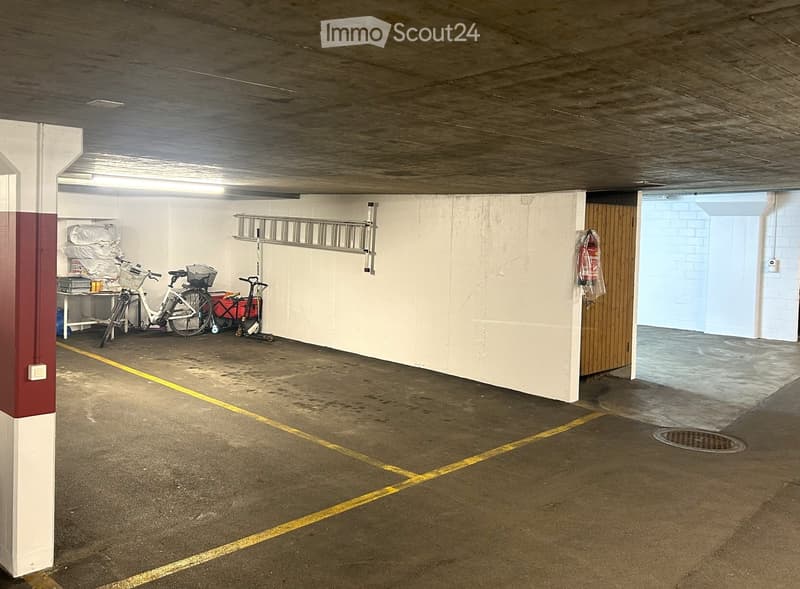 underground parking space, bicycle, trolley, fire extinguisher, ladder