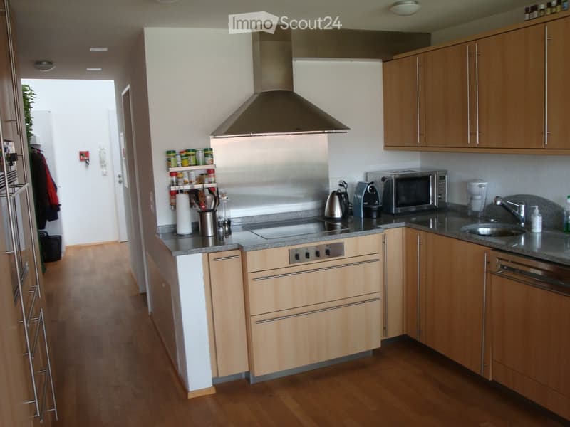 {"type": "Kitchen", "objects": ["cabinets", "stove", "microwave", "coffee maker", "faucet", "sink", "oven", "range hood", "cupboard", "bottle", "cup", "bottle", "bottle", "bottle", "bottle", "bottle", "bottle", "bottle", "bottle", "bottle", "bottle", "bot