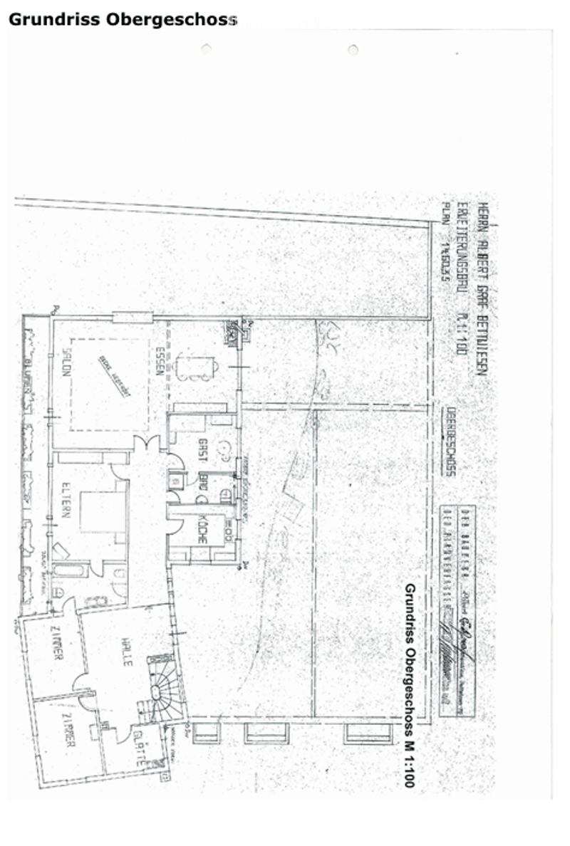 Floor plan of the upper floor showing multiple rooms including a living room, kitchen, bedrooms, and bathrooms.