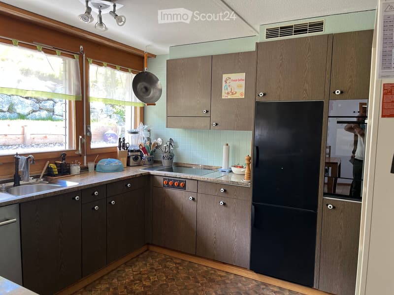 {"type": "Kitchen", "objects": ["sink", "faucet", "refrigerator", "oven", "cabinets", "blender", "frying pan", "cutting board", "bowl", "cup", "knife block", "spoon rack", "oven knobs", "faucet", "faucet handle", "faucet sprayer", "faucet sprayer handle",