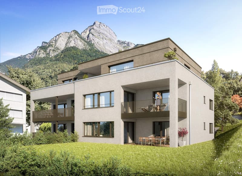 modern two-story house, three levels, large glass windows, multiple balconies, large grassy area in front, mountain view