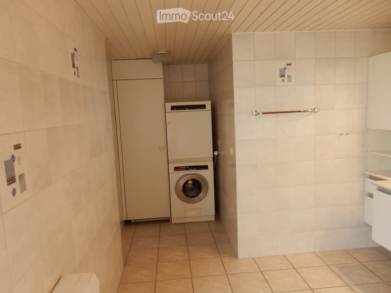Tiled floor, white walls, built-in refrigerator, washing machine, and dishwasher