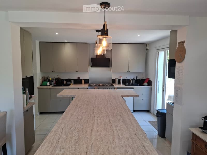 {"type": "Kitchen", "objects": ["cabinets", "countertop", "stove", "microwave", "refrigerator", "sink", "faucet", "cupboard", "bottle", "cup", "bottle", "bottle", "bottle", "bottle", "bottle", "bottle", "bottle", "bottle", "bottle", "bottle", "bottle", "b