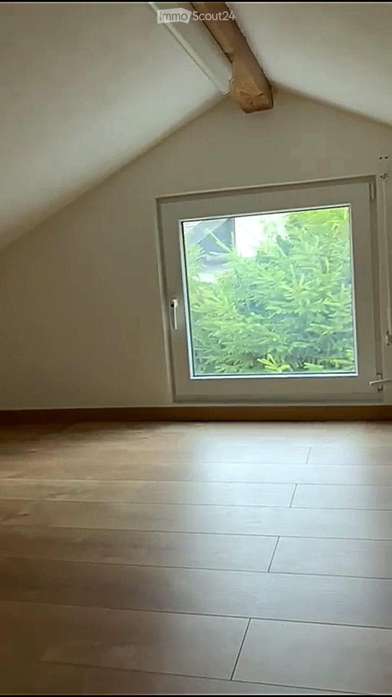 wooden floor, slanted ceiling, window, outdoor view