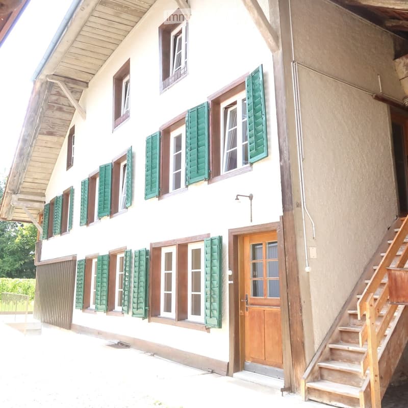 two story house, wooden door, wooden stairs, wooden railing, green shutters, white walls, windows
