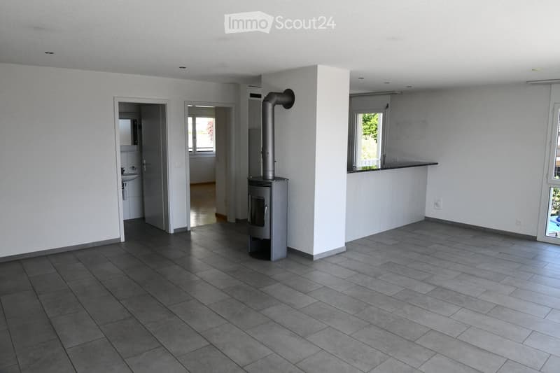 Fireplace, white walls, tiled floor, open layout