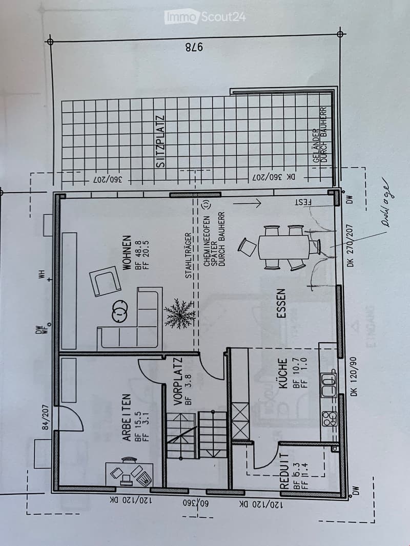 Floor plan showing a layout with labeled rooms including Wohnen (living area), Essen (dining area), Küche (kitchen), Arbeitszimmer (office), Vorplatz (entrance), and Sitzplatz (seating area).