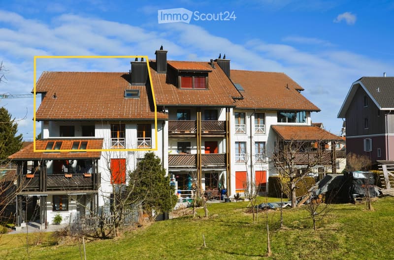 modern townhouse with multiple levels, balconies, raised ground floor, brown roof